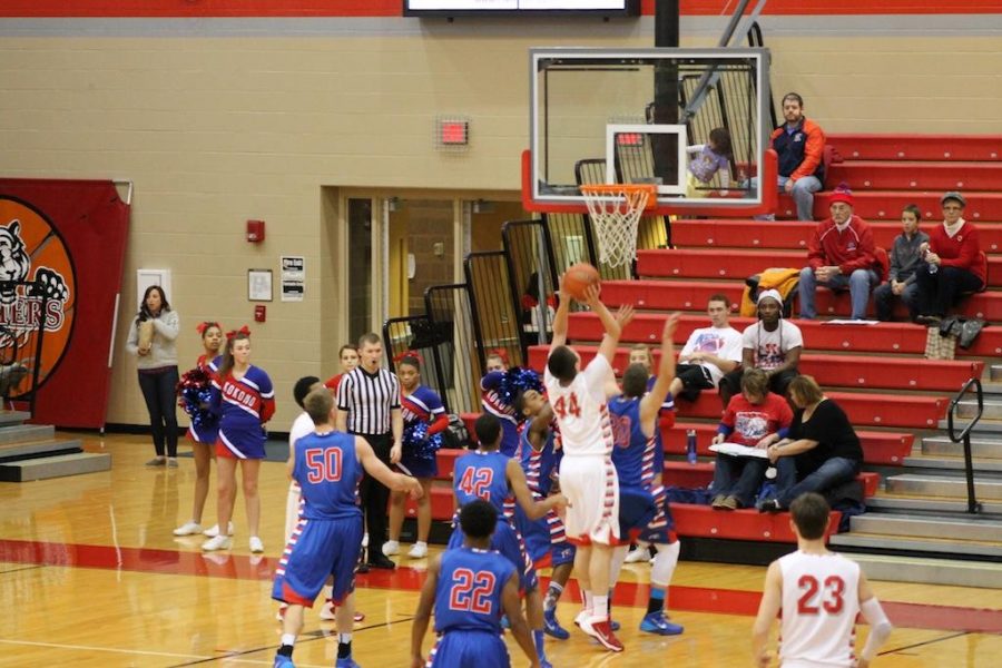 Sophomore Cameron Wolter jumps up to dunk the ball. - photo taken by Kristen Shaver