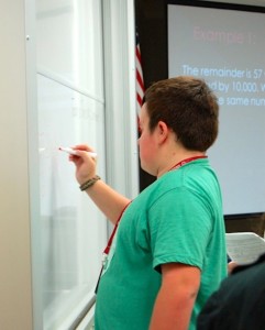 Freshman Matthew Jones writes on the board during an activity for Mrs. Dimos's 2nd period SAT prep class on Sept. 18. 