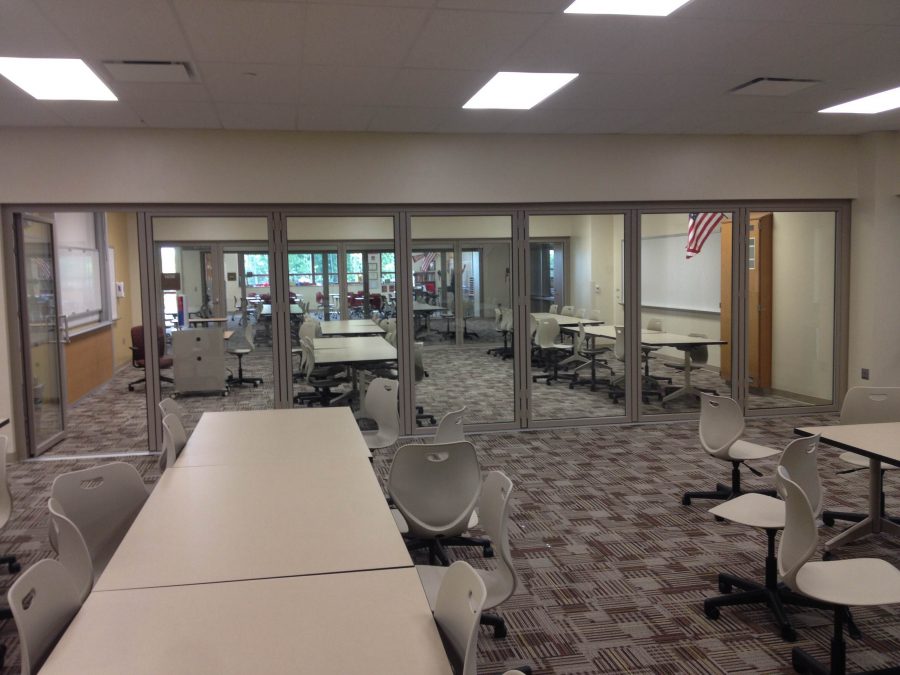 The new facilities have sliding glass doors and new tables and chairs. 