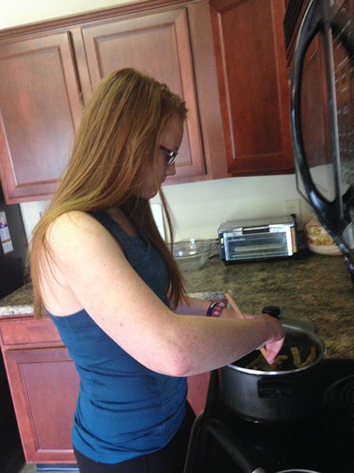 Senior Rachael Pyle utilizes her culinary skills to cook homemade chicken noodle soup.