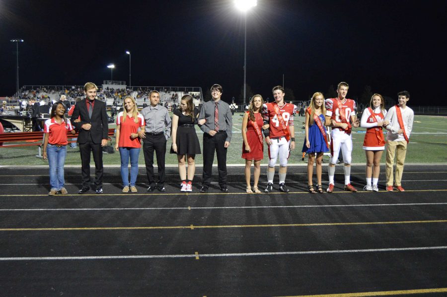 Students of homecoming court receive sashes at football game, Sept. 25.