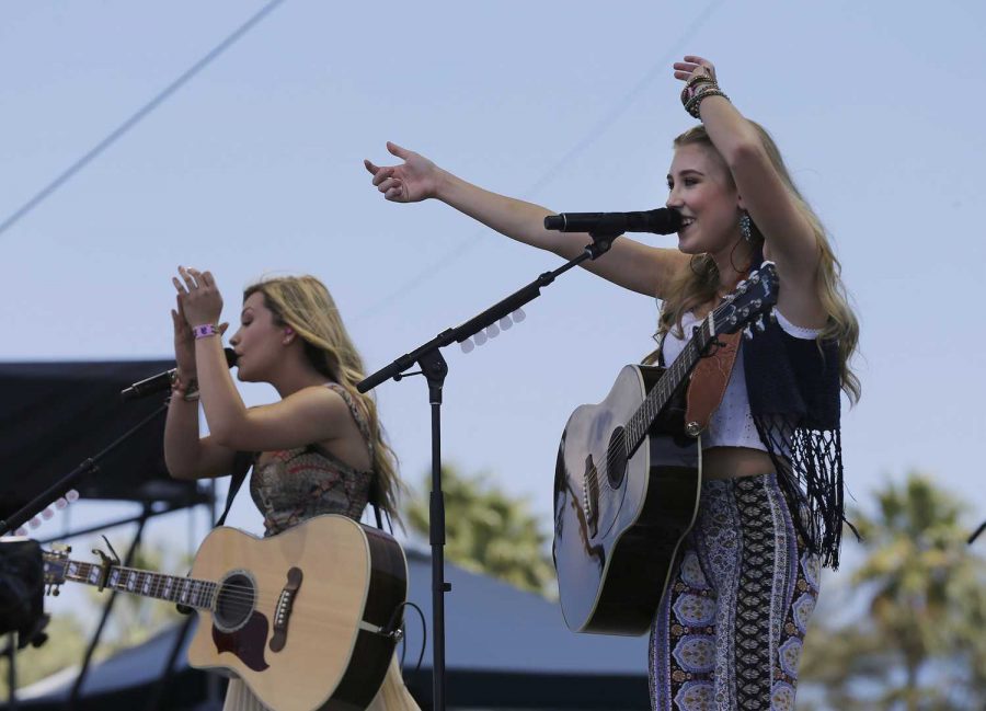 Taylor Dye, left, and Madison Marlow of Maddie & Tae perform on the Mane Stage during the final day of the Stagecoach Country Music Festival on Sunday, April 26, 2015, at the Empire Polo Club in Indio, Calif. (Allen J. Schaben/Los Angeles Times/TNS)