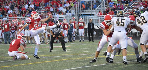 Sophomore Ben Norton punts the ball after another three and out for the Tigers at the homecoming game against Avon on Sept. 25.  FHS lost 36-14.