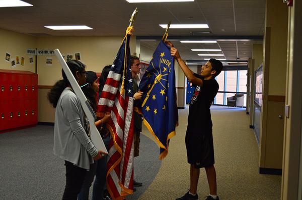 Members of the Armed Forces Club practice presenting the colors during their meeting on Nov. 10. 