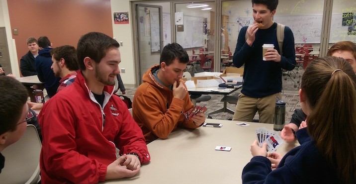 Euchre club members play a game of Euchre before school on Feb. 19.