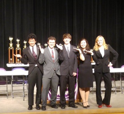 Juniors Matthieu Picard, Noah Alderton, Zane Jud, Olivia Jacobs and Sarah Frisbie accept an award after placing first in the World Debate division at the Indiana State Debate Competition on Saturday, Jan. 30. Photo courtesy of Matthew Rund.