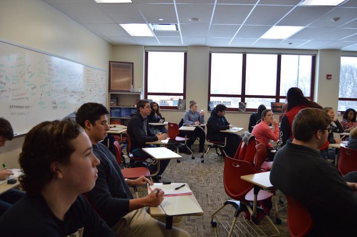 Seniors+sit+and+listen+in+their+first+period+economics+class%2C+a+credit+required+to+graduate%2C+with+teacher+Michael+Gaines+on+January+20.