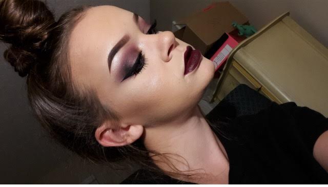 Senior Emily Thompson wears a smokey, wine red eyeshadow look with contouring and highlighting her face. Photo used with permission of Emily Thompson. 