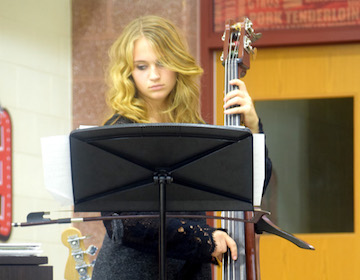 Sophomore Jenna Burow plays the bass for a piece at the jazz band concert on Nov. 18. Photo by Megan Jessup.