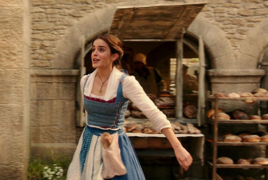 In the new live-action Beauty and the Beast Belle, played by Emma Watson, skips through town as she sings about wanting more than a simple provincial life. Photo used with permission of Tribune News Service.