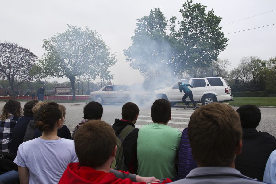 High school seniors watch a drunk driving crash simulation in Hinsdale, Ill., on April 27, 2016. Photo used with permission from Tribune News Service. 