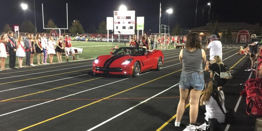 Senior+court+member+Hannah+Flint+takes+her+celebratory+ride+in+a+red+Corvette+on+Sept.+22.+Each+member+was+designated+their+own+car.+Photo+used+with+permission+of+Hannah+Flint.