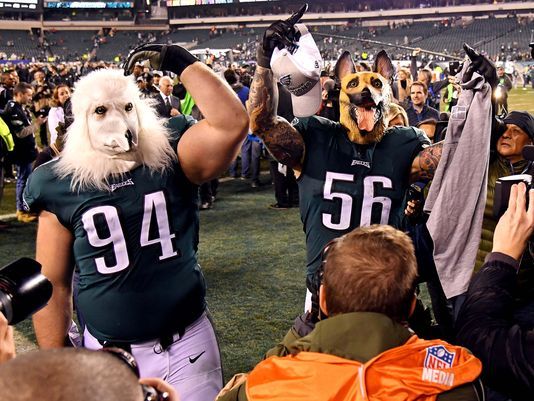 Eagles’ defensive players Beau Allen and Chris Long celebrate the victory of the NFC Championship by wearing dog masks to symbolize the underdog status that they have been riding on all playoffs. Photo used with permission of BipHoo Company.