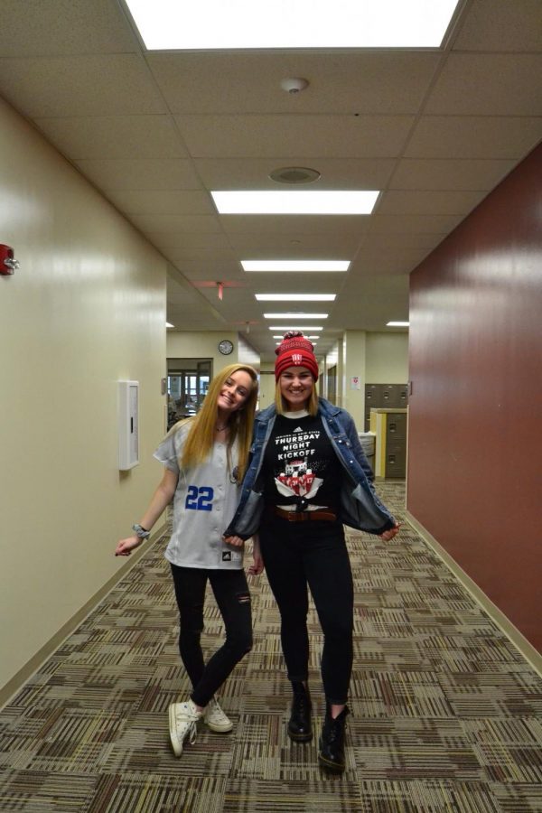 On College/Jersey day, seniors Makayla Pruett and London Osmun smile wide as they wear their spirit wear. Osmun dressed in an Indiana University beanie and an Indiana University basketball teeshirt while Pruett wore an Indiana University Fort Wayne Mastodons baseball jersey on Monday, March 12. Photo by Sawyer Osmun.