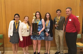 (Left to right) Juniors Tiffany Le, Rebekah White, senior Sarah Hiatt, junior Hope Fury, sophomore Collin Tully and math teacher John Drozd hold the FHS team trophy for the competition. Photo used with permission of John Drozd.