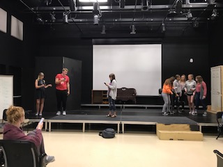 Junior Hailey Davis (lower left hand corner) directs theater students in the play “Where the Wild Things Are” on May 7. Photo by Sydney Greenwood.

