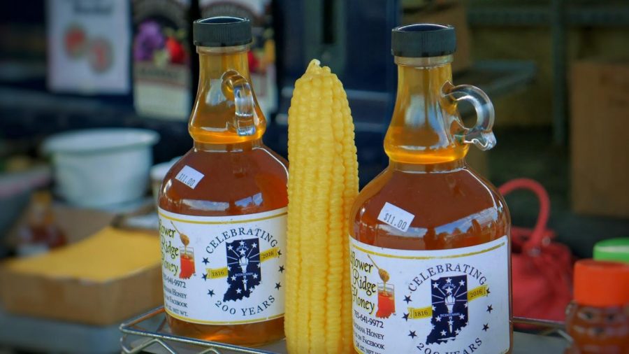 A local vendor displays honey for retail at the Fishers Fall Farmers Market on Saturday Oct. 6.