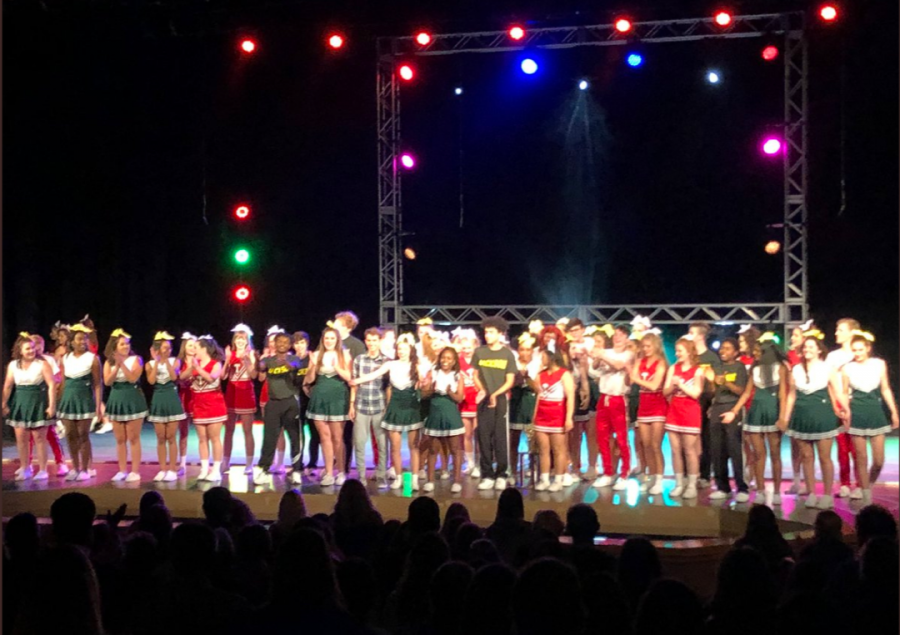 The cast of “Bring It On: The Musical” cheers along with the crowd as they take their final bows on the closing night on Nov. 17. 