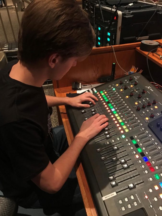 Senior Liam Green sets sound cues for Friday and Saturday 
night shows of Bring It On on Nov. 16. 