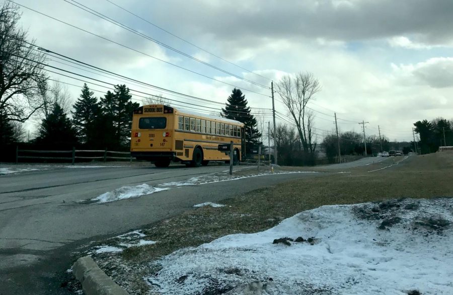 An+HSE+schools+bus+leaves+Fishers+High+School+along+Hoosier+Road+on+Jan.+29+in+freezing+temperatures.+