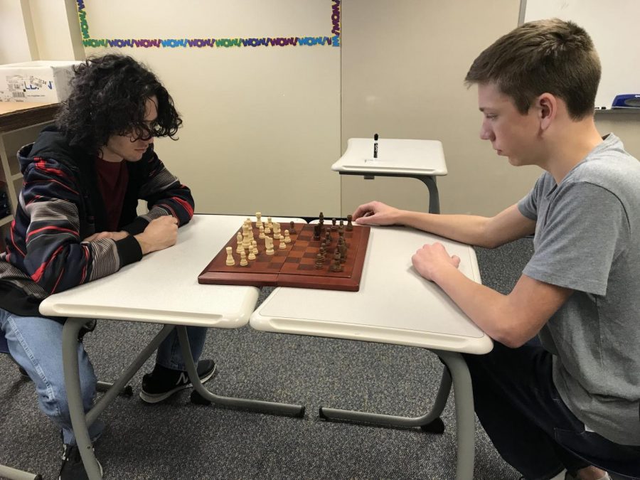 Senior Jacob Frollo and freshman Miles Morosi begin a game of chess at the club meeting on Jan. 17.