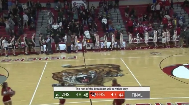 The Tigers and the Eagles shake hands at the end of the conference on Feb. 15. Despite technical difficulties, the Fishers Sports Network streamed the game on Twitter.