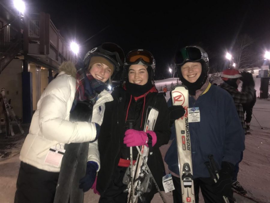 Seniors Makayla Palmer, Gwyn Milikin and Lauren Hege prepare to go down the slopes of the Perfect North Resort. 