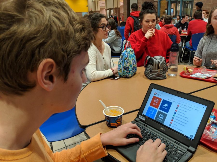 Sophomore Hugh Darrow checks the schedule for the week of spring ISTEP testing on Feb. 4.