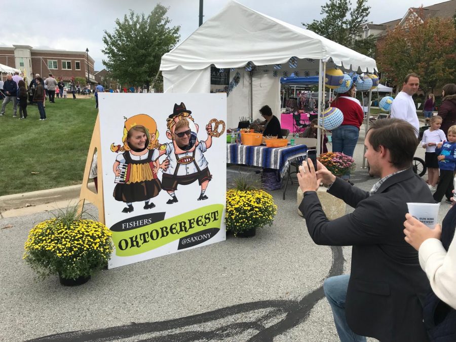 Oktoberfest attendees pose for pictures at the event in 2018. 