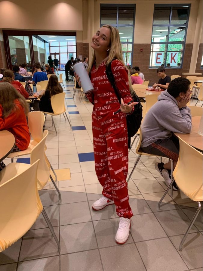 Junior Elle Hines is wearing an IU onesie $40, Nike air forces in red $90,
with her baby blue hydro flask $44.95.
