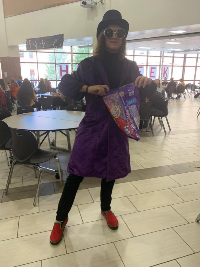 
Junior Nealon Jones dressed up as Willy Wonka from Charlie in the chocolate factory, jacket: $31.97, black turtleneck $28, black jeans $24.99, and red and green vans $75.