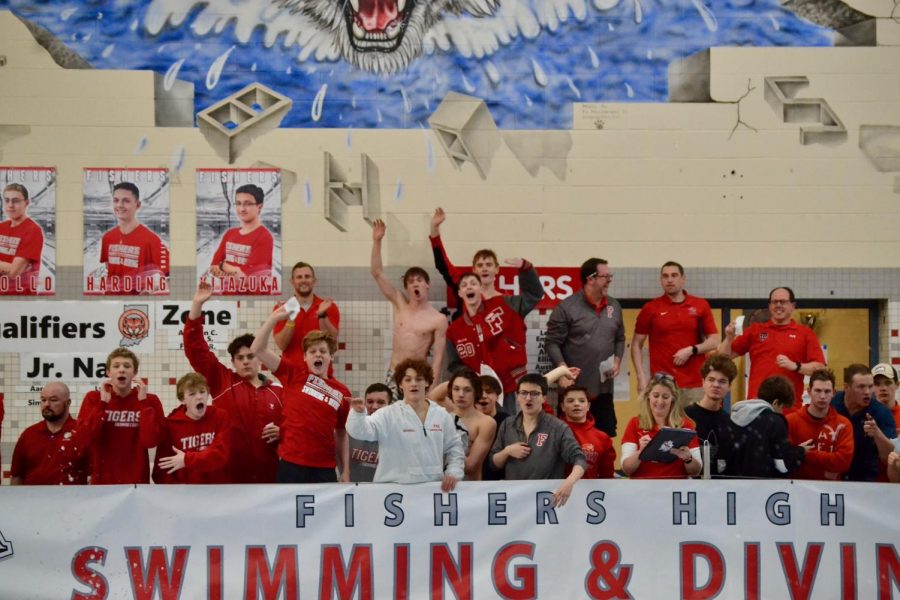 Teammates and coaches cheer on the athletes on the final leg of the 200 freestyle relay, as they remain inches ahead of the HSE relay. The FHS relay won first place and set a new school record.