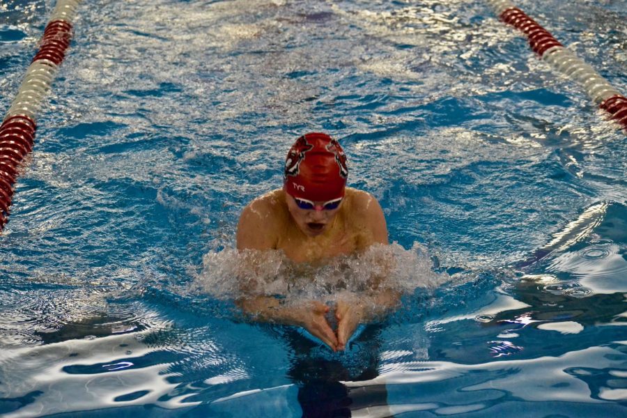 Freshman Dan Bennett prepares for a turn at the wall during the 100 breaststroke. Bennett tied with another FHS swimmer for fifth place