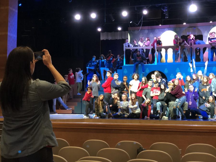 Cast and crew pose for a photo in the auditorium on Mar. 16 before beginning the month long break from school.