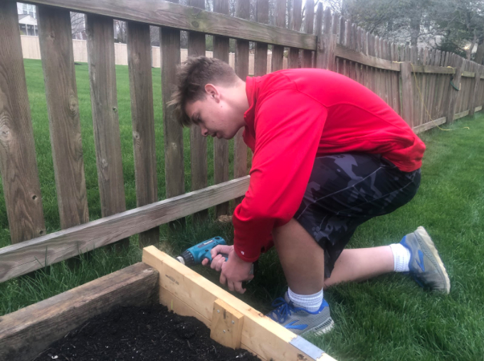 Junior Josh Zimmerman keeps himself busy over spring break by doing things around the house like yard work. Photo courtesy of Josh Zimmerman.