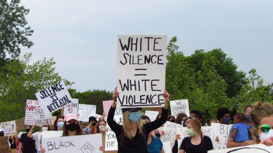 Signs reading phrases similar to White silence = white violence were seen ll throughout the grounds of the protest.