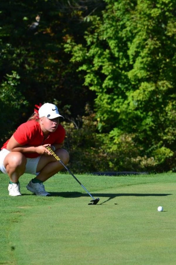 McVay eyes the lie of her ball on the green before a putt on Aug. 21.