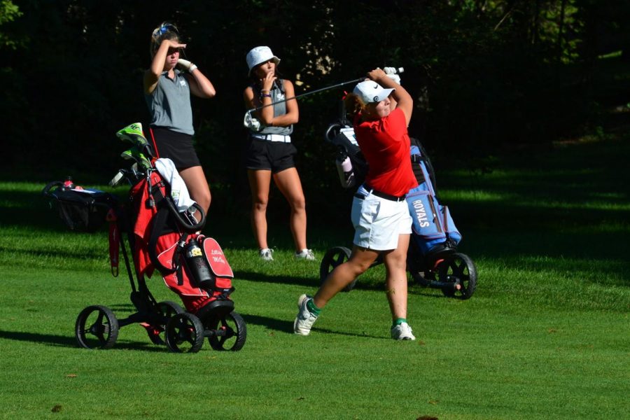Junior Lillian McVay tees up during the girls golf meet on Aug. 21.