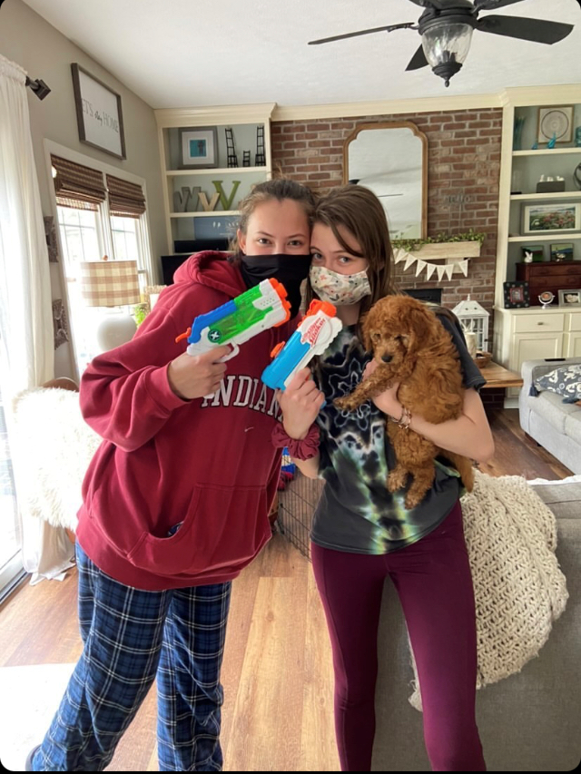 Seniors Janie Vanoverwalle and Alexis Howard take the traditional post-elimination picture after Vanoverwalle eliminated Howard at her house on April 29.