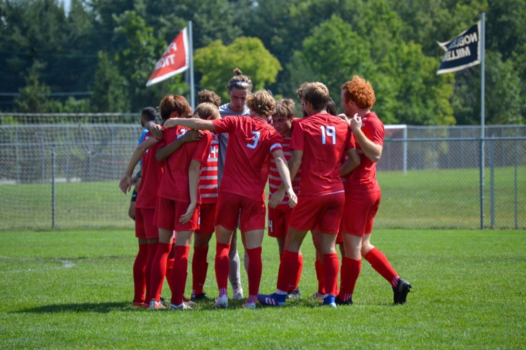 Starting players huddle up before the beginning of the match. “It feels great to be freshman on varsity especially with this group of boys on the team. They make it seem like I’m not a freshman.” freshman Caleb Hernandez said. FHS defeated McCutcheon High School 4-0.