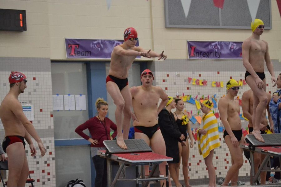 Freshman+Tommy+Johanneman+prepares+to+jump+in+for+his+leg+of+the+relay+on+Jan.+22+at+the+Fishers+pool.+%0A