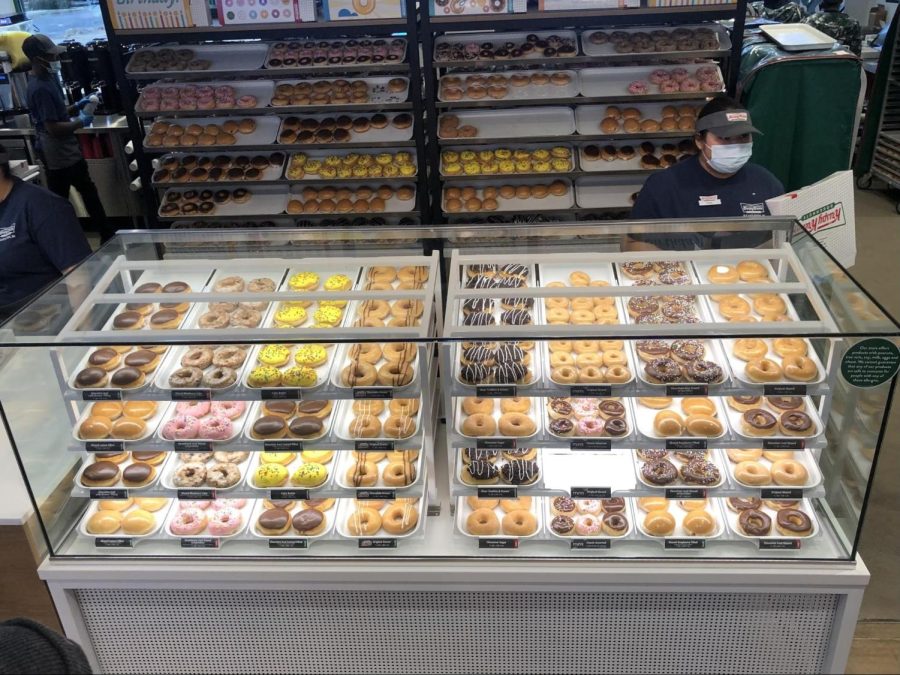 Inside Krispy Kreme an assortment of donuts displayed, ready for excited customers to purchase on Thursday, March 3. 