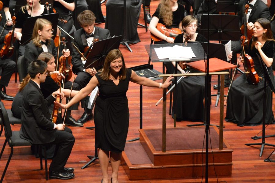 Orchestra director Julie Armey bows for the audience after finishing a piece. “Afterwards, the crowd gave us a standing ovation,” Freeman said. “I teared up a little bit when that happened.”