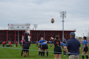 On May 4, Sophomore Ashlei Reeves prepares to catch the ball in a lineout. The lineout occurred after the ball was carried out of bounds by the Mudsock rugby team. “If it’s our ball, we want to keep the ball by getting up first,” Reeves said. “If it’s their ball, we are basically trying to steal the ball so that our team can have it.”