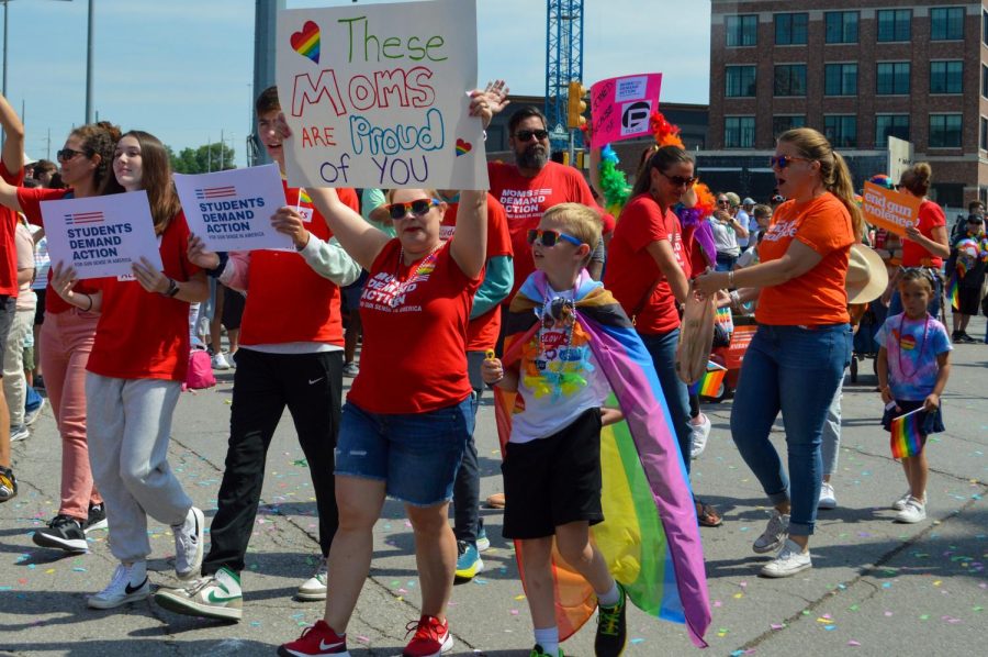 A mother and son march with the Moms Demand Action organization in the Indy Pride Parade.“Pride is such a great way to bring people together,” Puccinelli said. “It is an opportunity for all different types of people to express themselves and bond.”