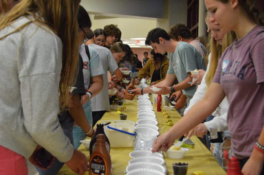 Fishers and HSE students create their banana split’s at a Cru meeting on August 29 at Fishers High School.