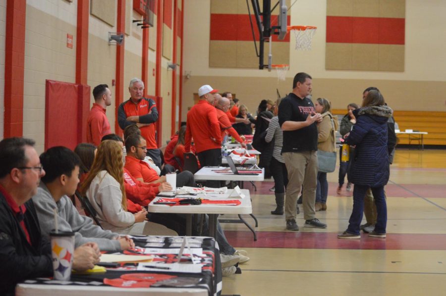 Representatives and coaches of several school athletic teams converse with parents. Eighth-grade parent night took place Feb. 1.