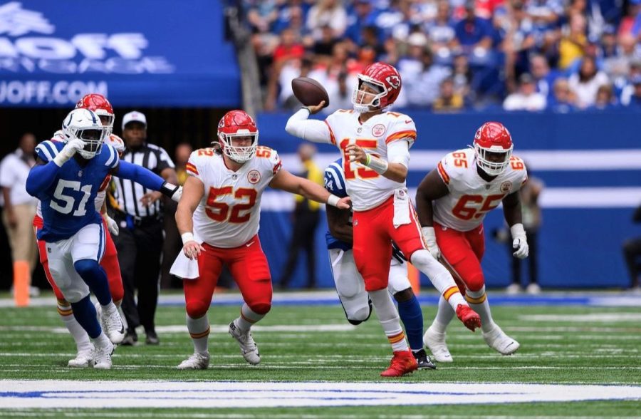 Chiefs quarterback Patrick Mahomes contorts his body to avoid a sack in a 20-17 loss vs. the Colts on Sept. 25, 2022.