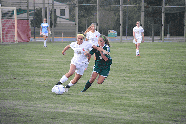 Sophomore Julia Calvert dribbles down the field when facing Westfield on Aug 20.