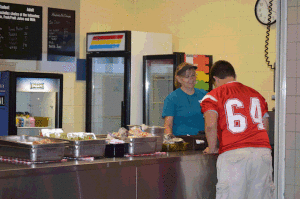 Student buying a cookie from the After Thoughts line. Photo taken by: Natalie Lueung